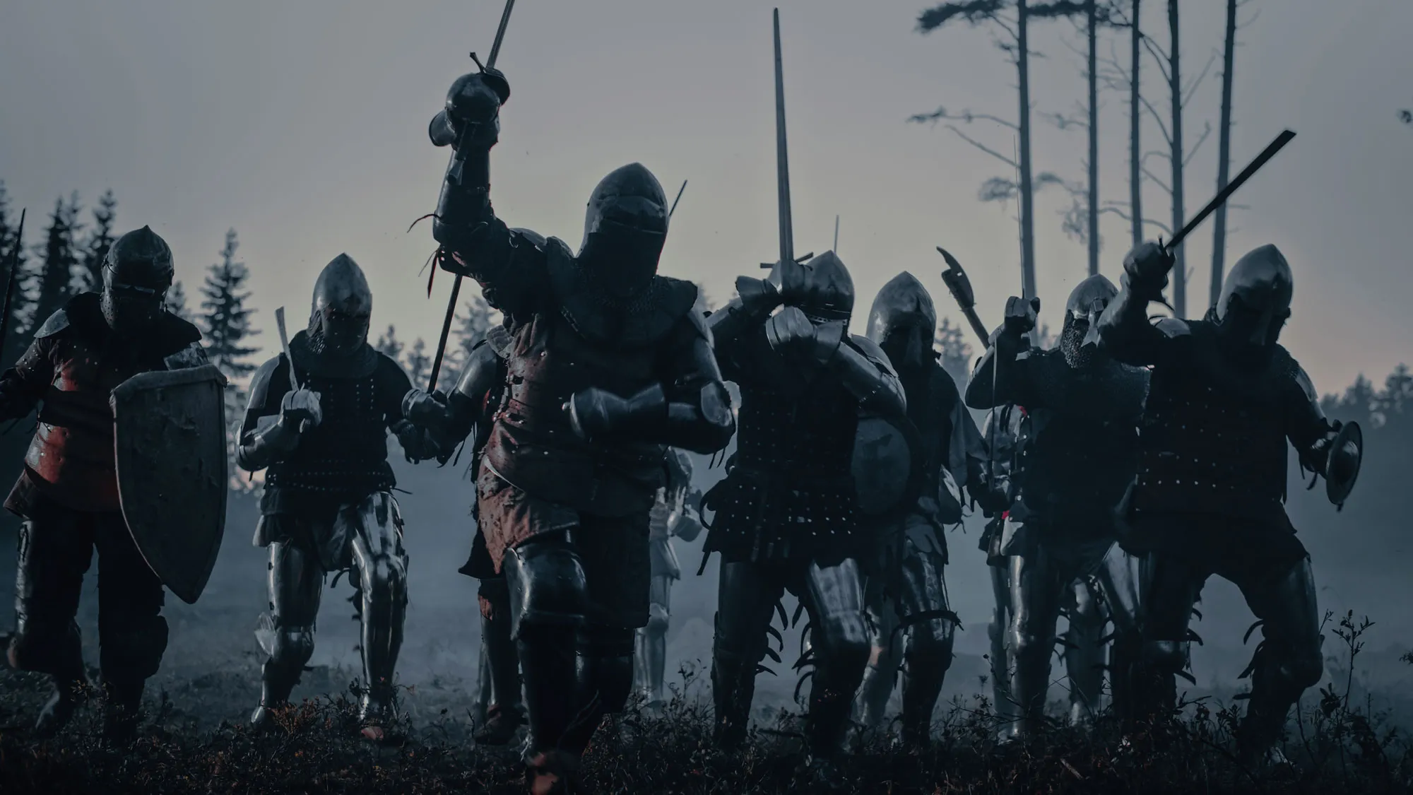 Knights fighting in a field.