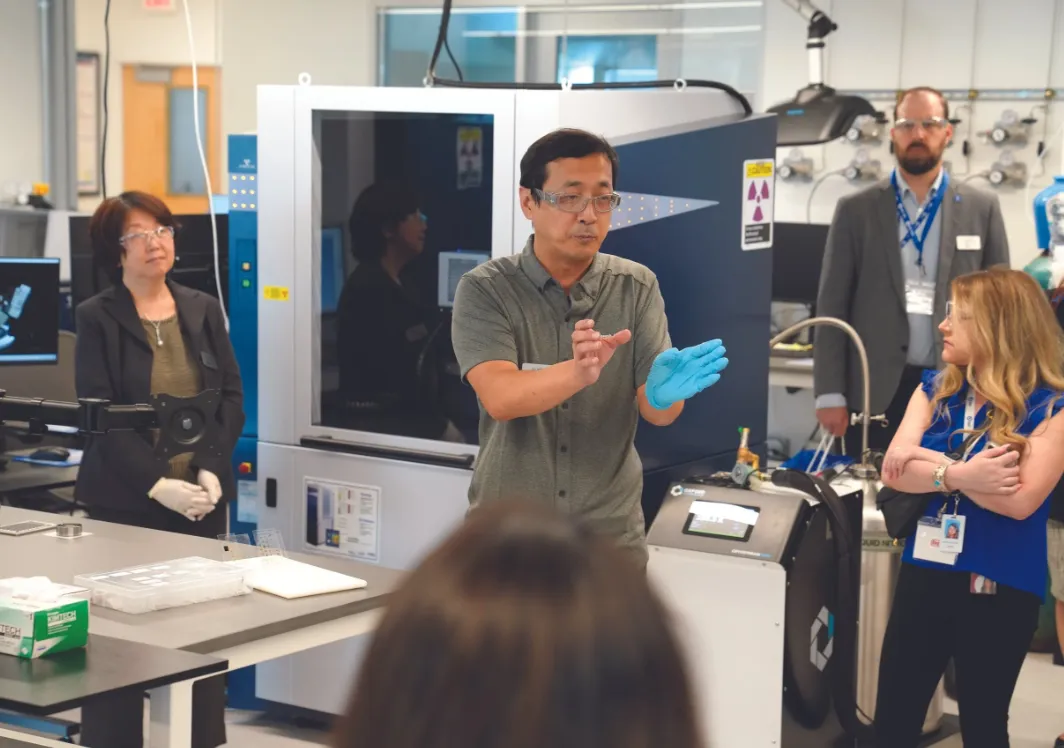 A group of people learning in a lab.